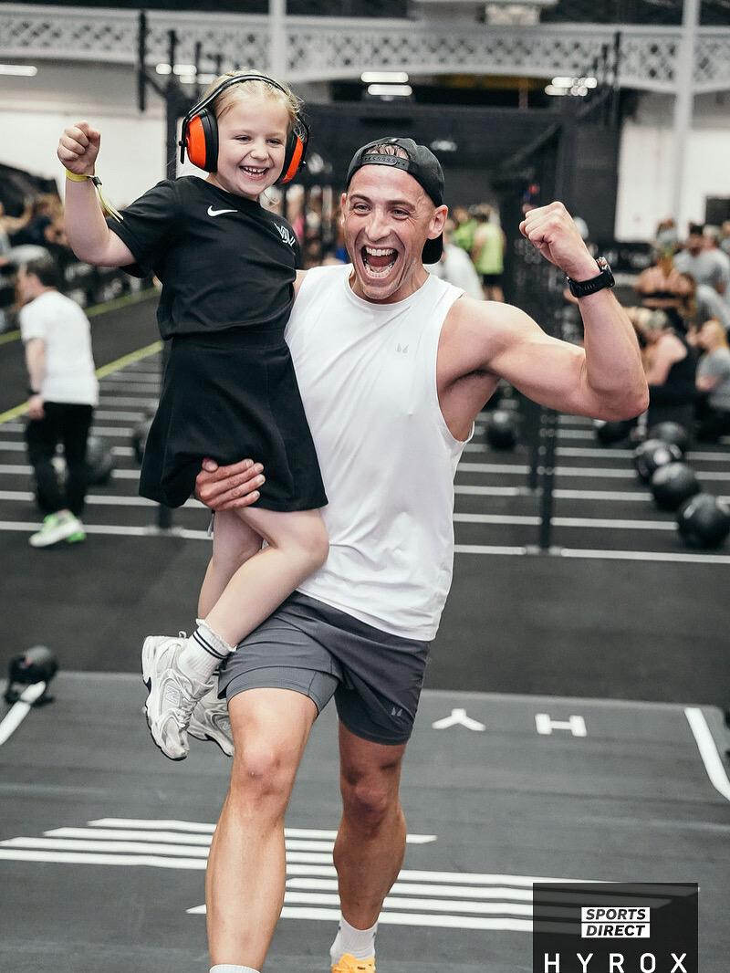 Dan celebrating with his daughter